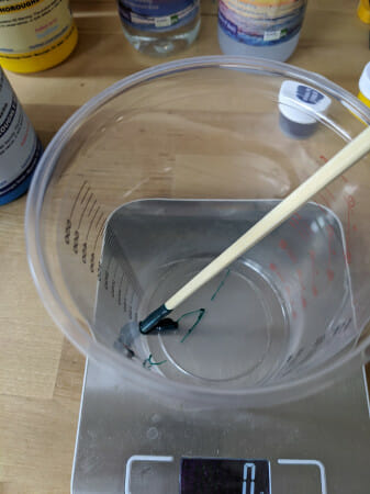 If you are using colourant, add it now. A very small amount will be enough. I use a chopstick to stir the pot, and just used the amount that’s stuck on the chopstick. put it in the mixing cup, and zero the scale.
